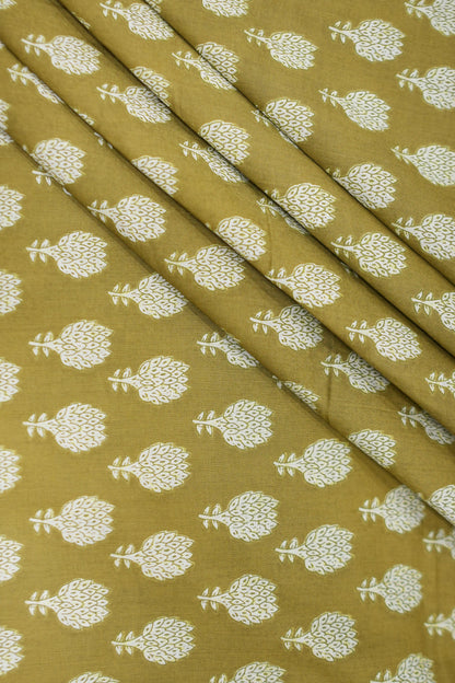Fabric with white floral pattern on a mustard yellow background