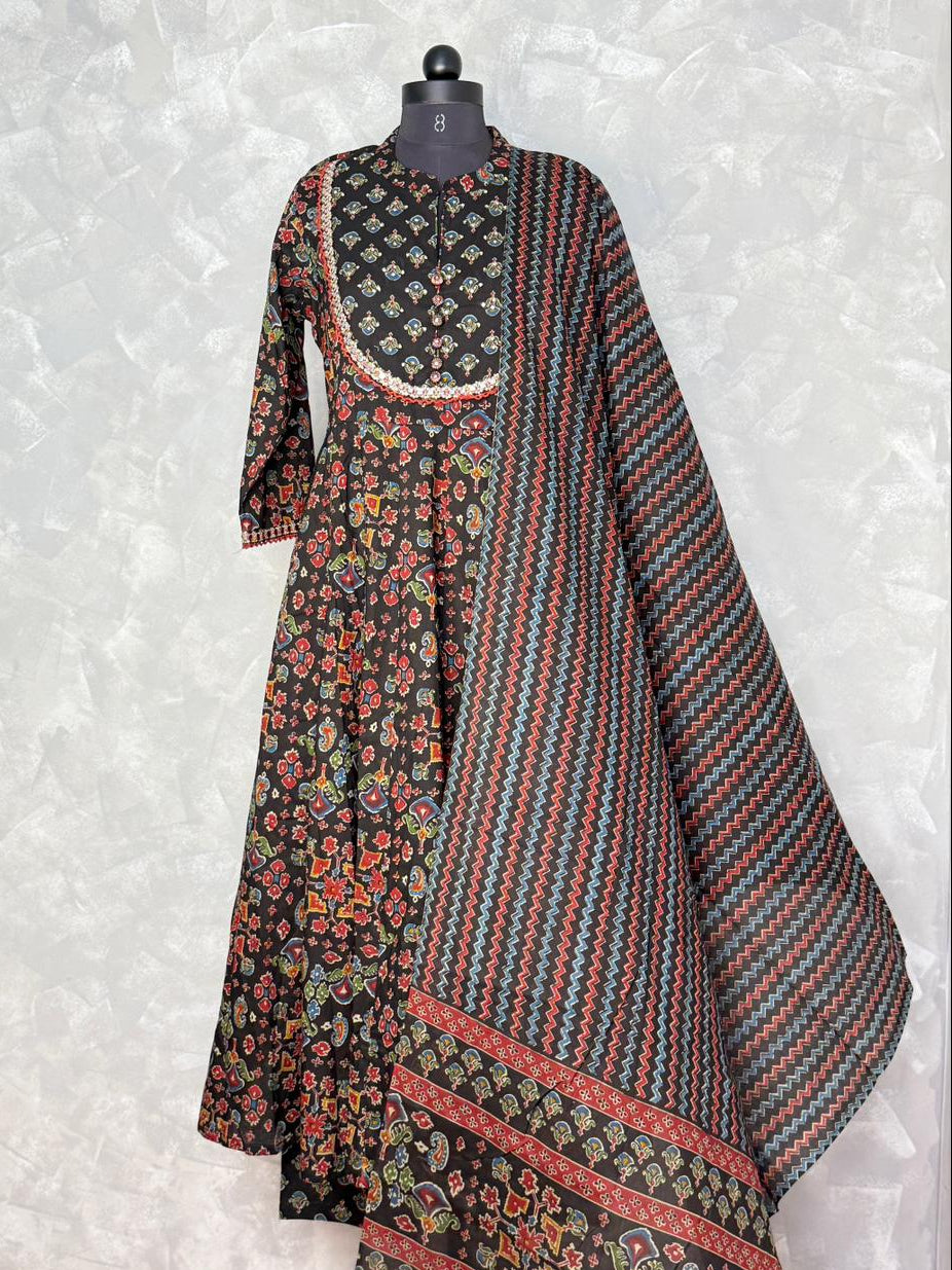 Traditional outfit with floral and striped patterns on a mannequin against a light gray background