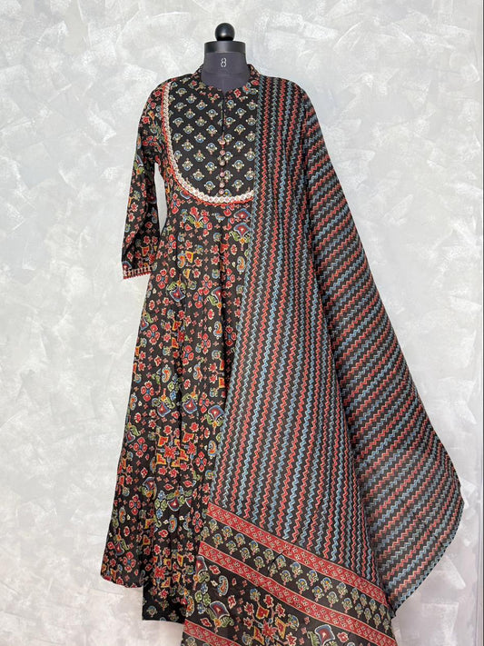 Traditional outfit with floral and striped patterns on a mannequin against a light gray background